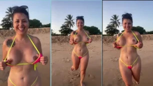 Kah Kampa, el gato travieso, disfrutando de una carrera en la playa desnuda en el porno